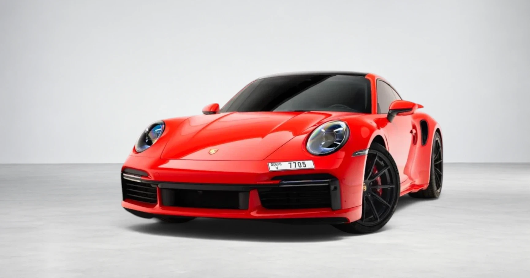 Porsche 911 Turbo S Akrapovic Edition Carmine Red luxury rental Dubai