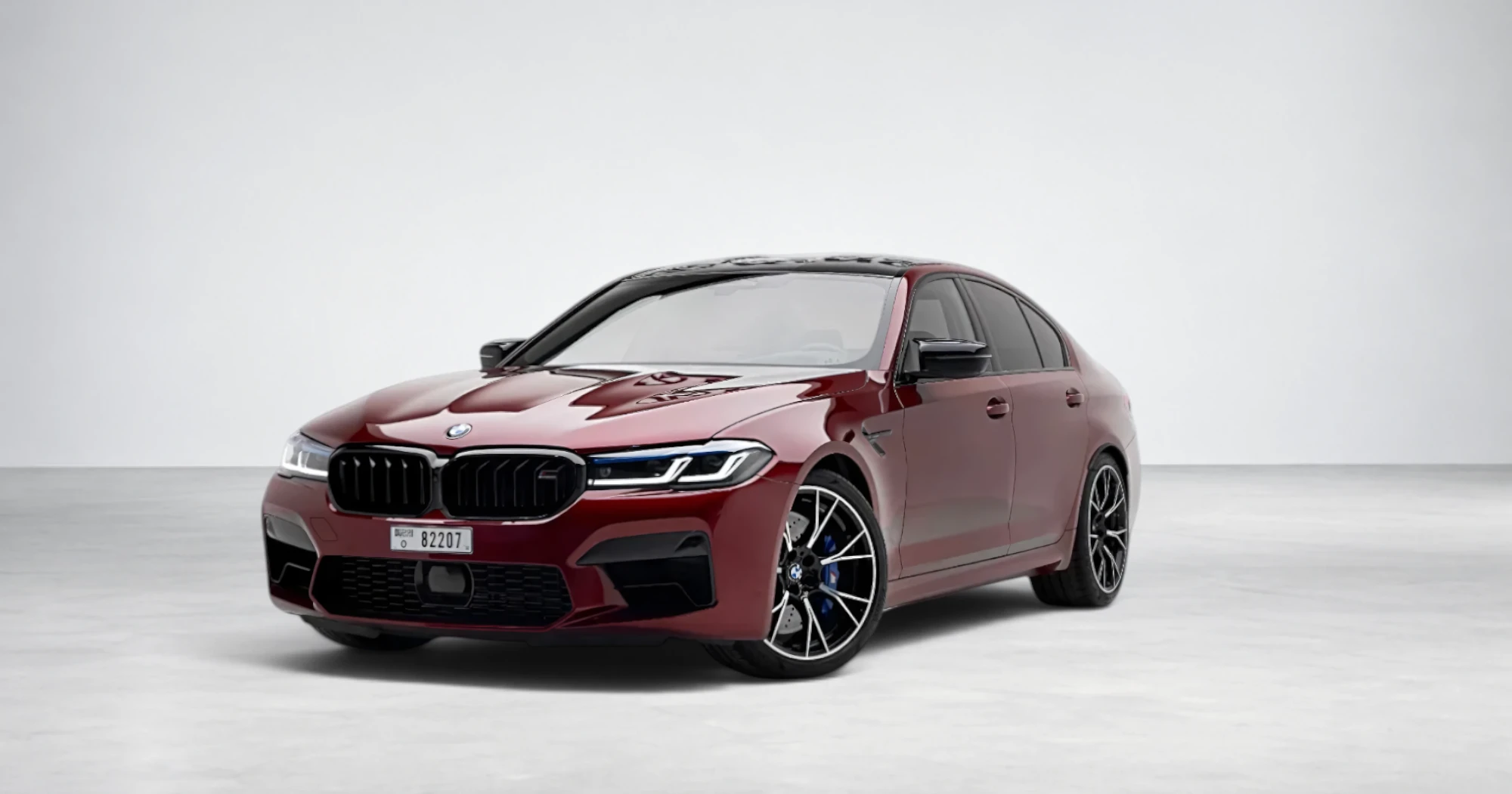 BMW M5 Competition — Motegi Red luxury rental Dubai